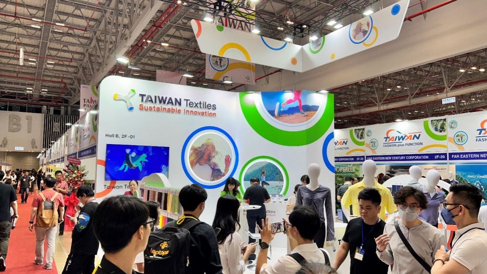 Marketing students visiting exhibition booths in practice.